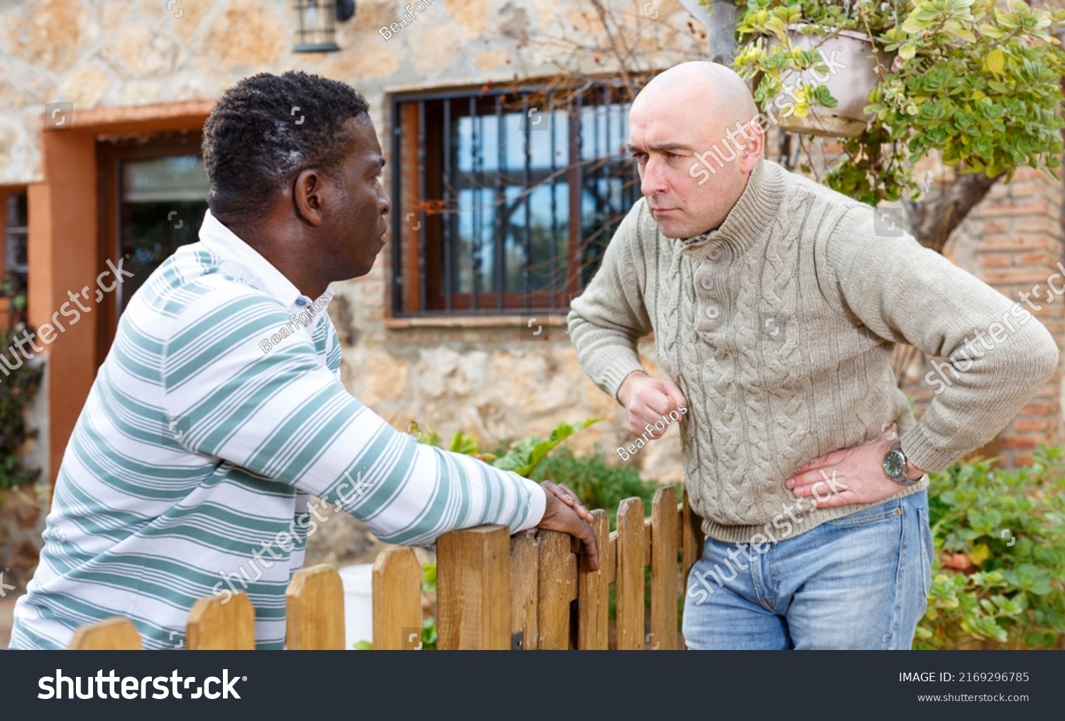 Quarrel of two neighbors in the country in the village. High quality photo #2169296785