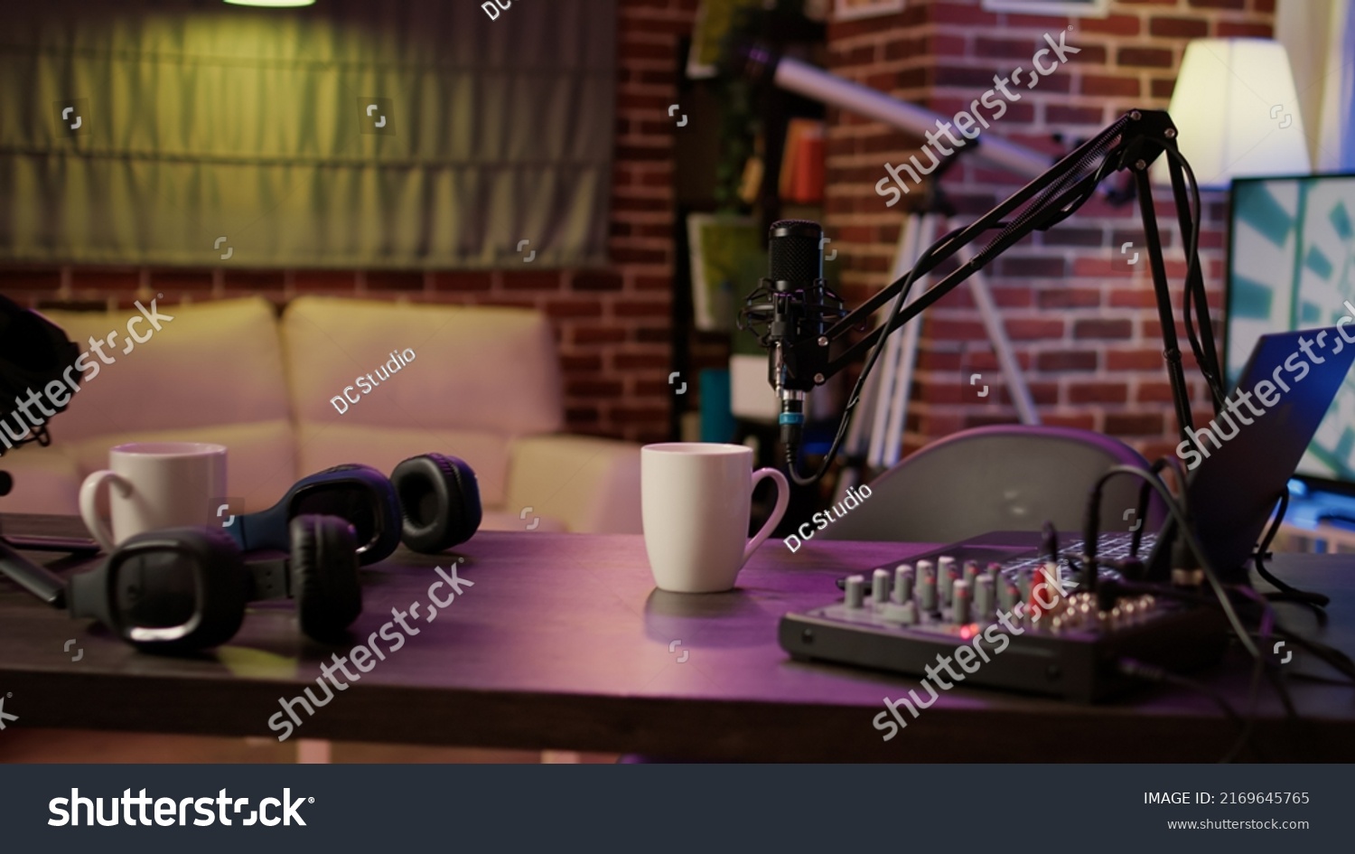 Nobody in podcast home studio with microphone boom arm and audio recording professional mixer on desk. Empty internet online radio setup for producing podcasts for social media. #2169645765