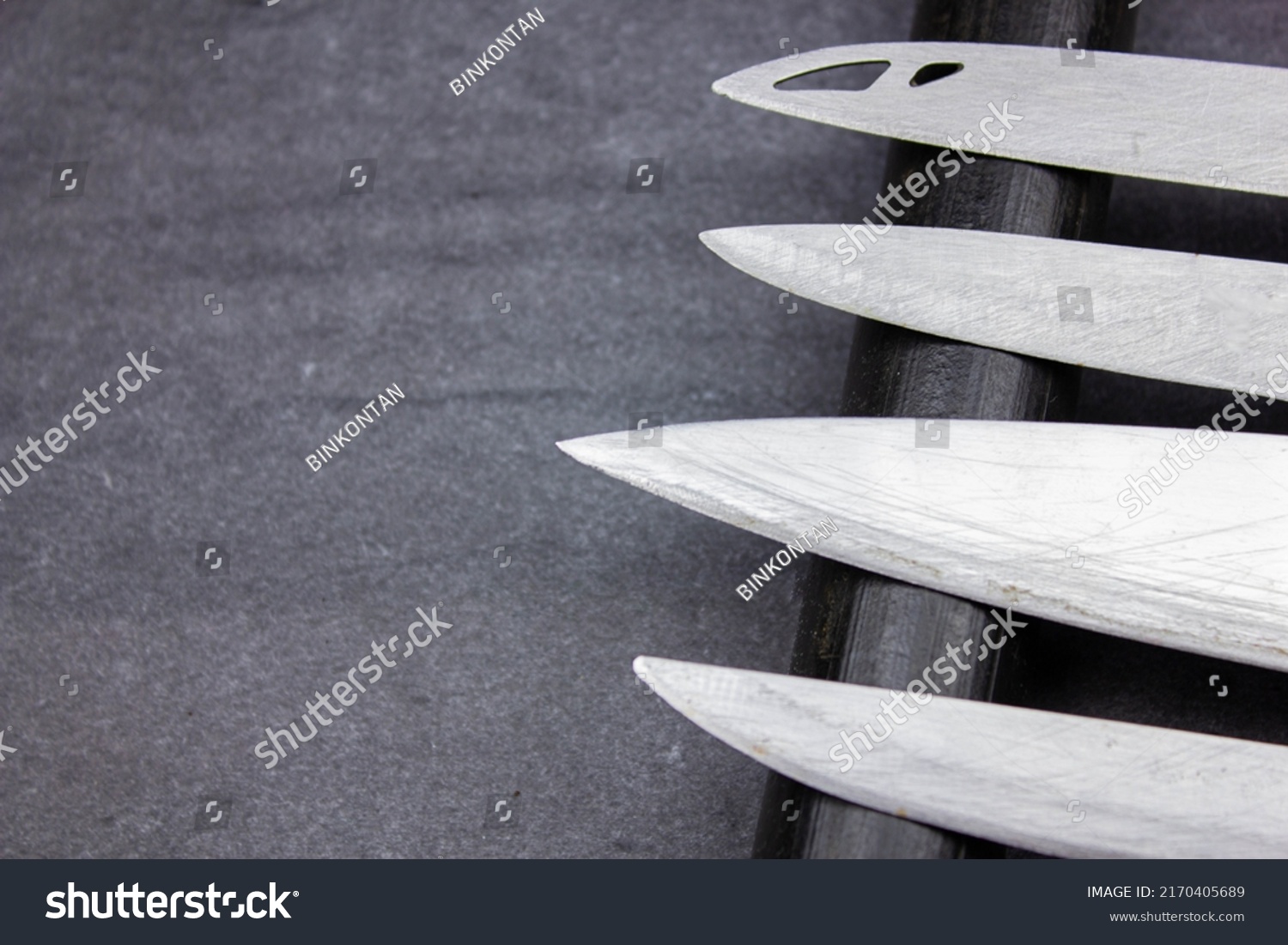 The Blades of knives concept. Sharp steel blades of knives on a dark background. Sharp knives collection. #2170405689