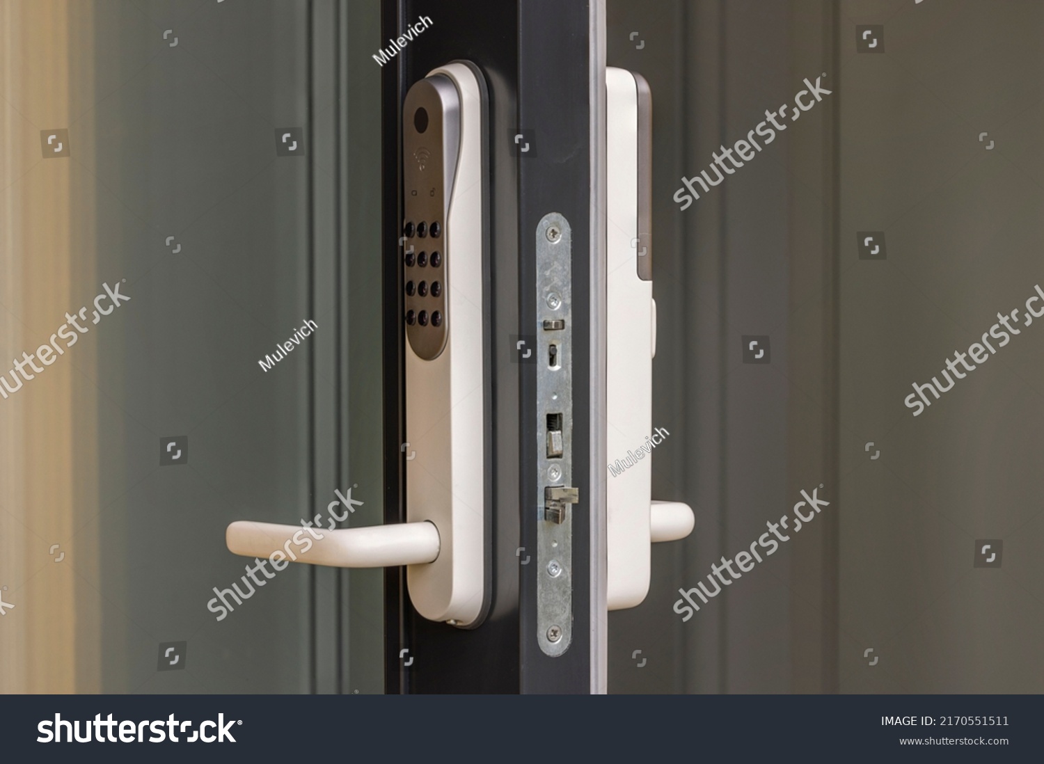 Close up view at open entrance door with modern white digital lock isolated.  #2170551511
