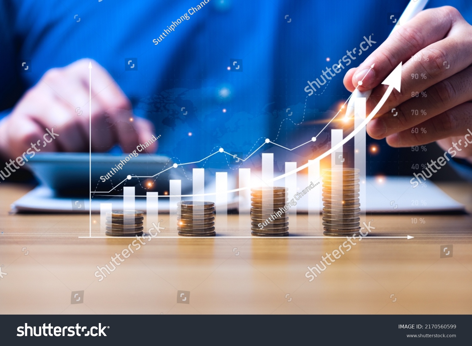 financial business growth concept. businessperson calculate income and profit on investments and an increase in the indicators of positive growth, with virtual holographic chart graph. rich, coin #2170560599