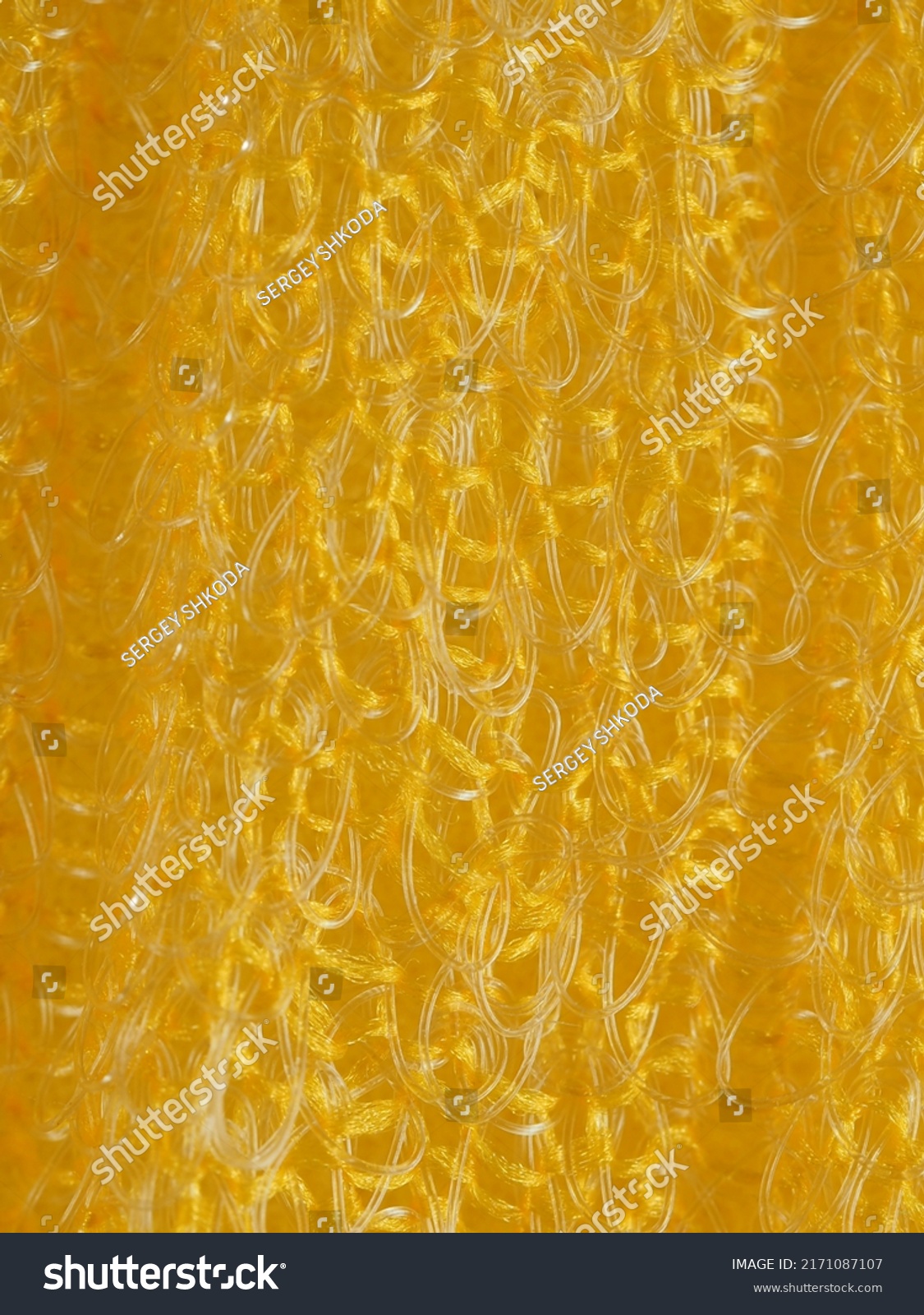 close up, background, texture, large vertical banner. heterogeneous surface structure bright saturated yellow sponge for washing dishes, kitchen, bath. full depth of field. high resolution photo #2171087107