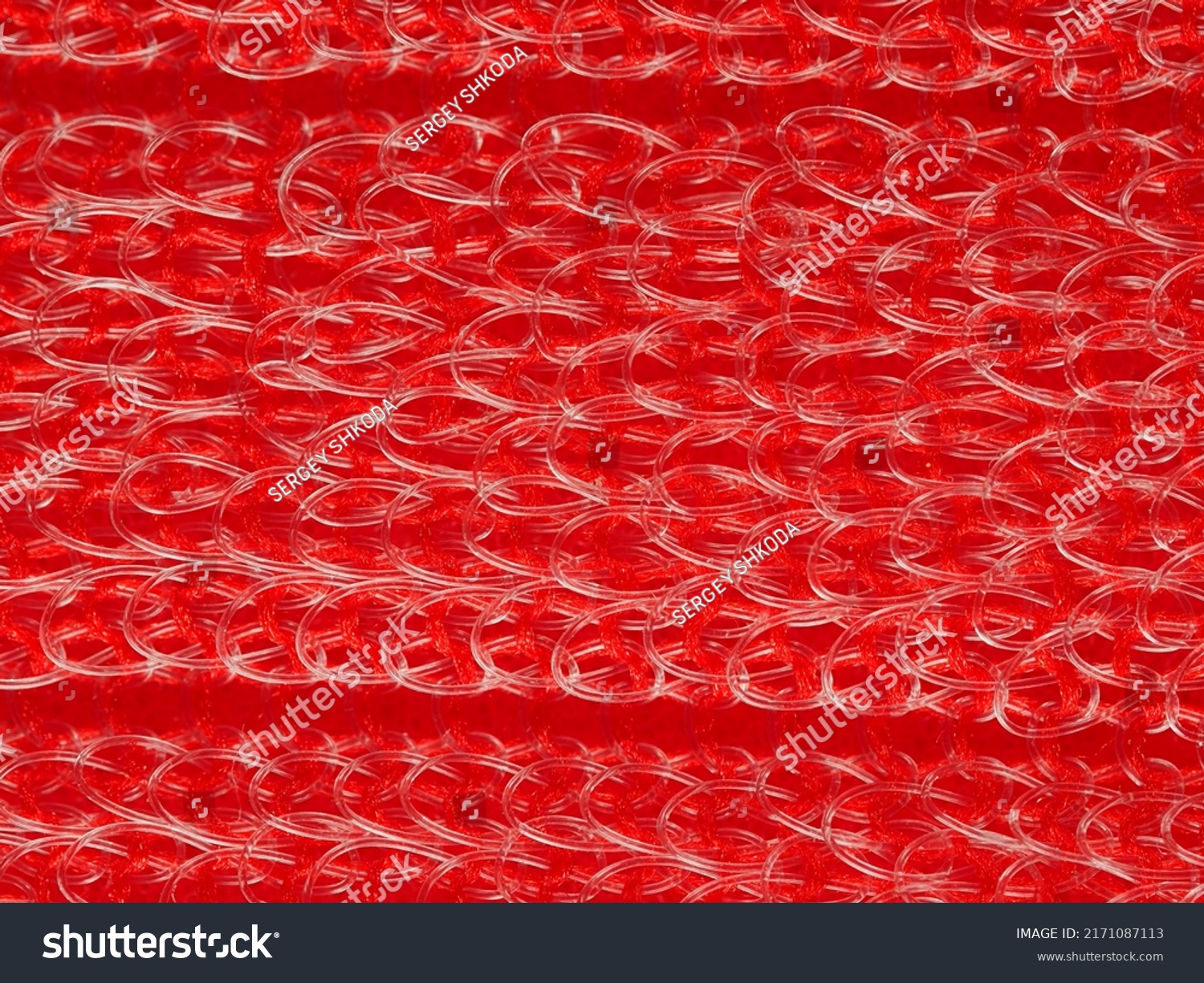 close up, background, texture, large horizontal banner. heterogeneous surface structure bright saturated red sponge for washing dishes, kitchen, bath. full depth of field. high resolution photo #2171087113