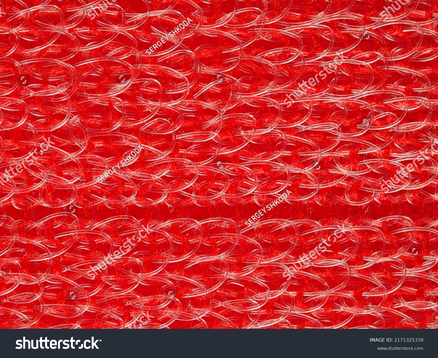 close up, background, texture, large horizontal banner. heterogeneous surface structure bright saturated red sponge for washing dishes, kitchen, bath. full depth of field. high resolution photo #2171325339