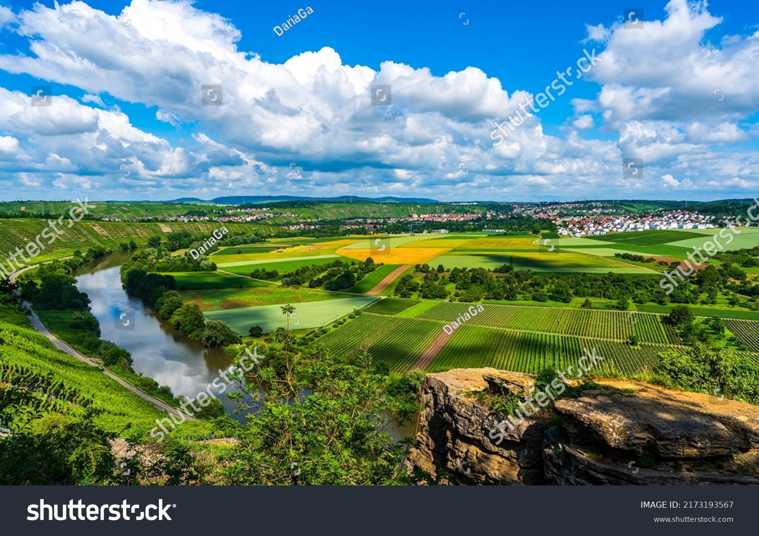 River valley with agricultural fields. Cloudy sky over summer agriculture fields. Agricultural fields in summer. Agricultural field landscape #2173193567