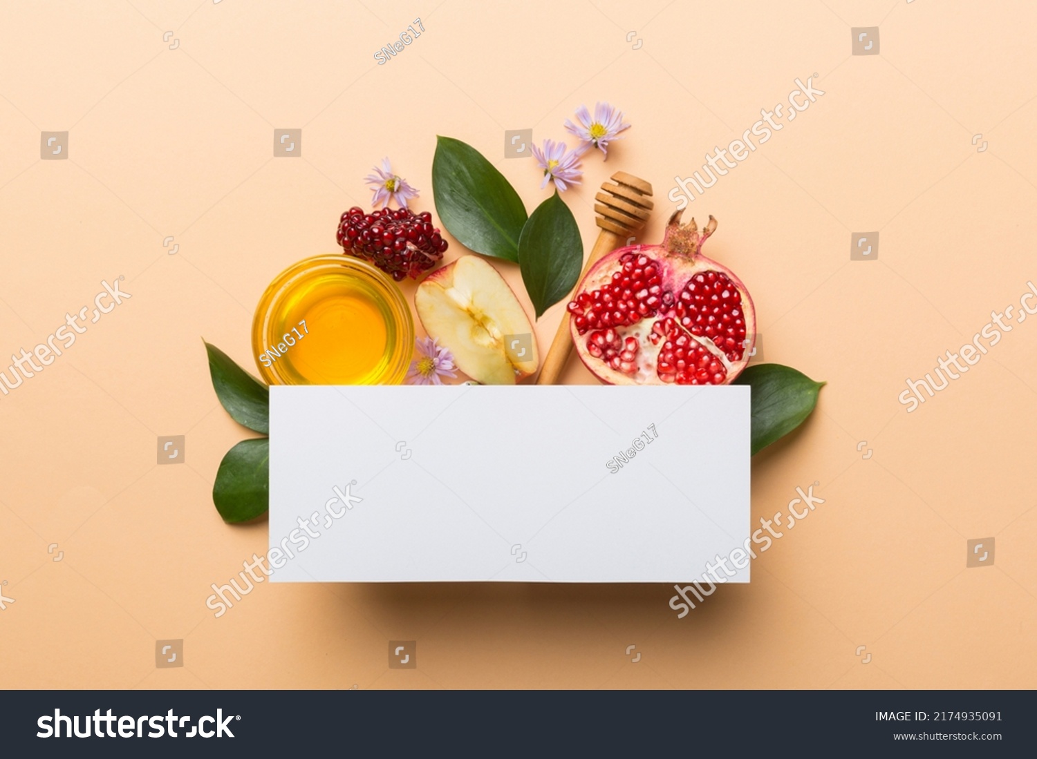 Flat lay composition with Blank flyer poster and symbols jewish Rosh Hashanah holiday attributes on colored background, New Year holiday Traditional. Top view with copy space mock up. #2174935091