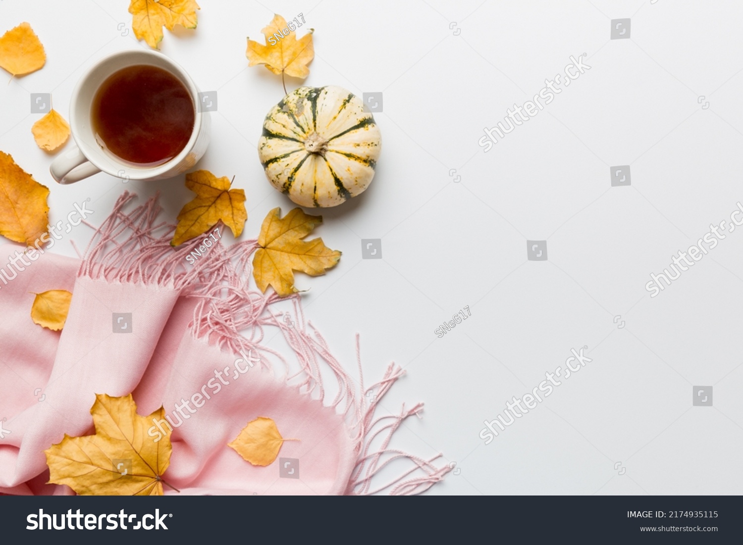 Flat lay composition with colorful Autumn cup of coffee and leaves on a color background. top view. #2174935115