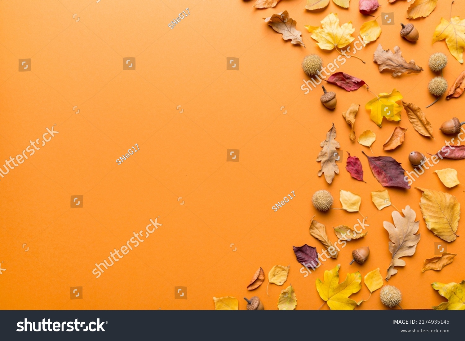 Autumn composition. Pattern made of dried leaves and other design accessories on table. Flat lay, top view. #2174935145