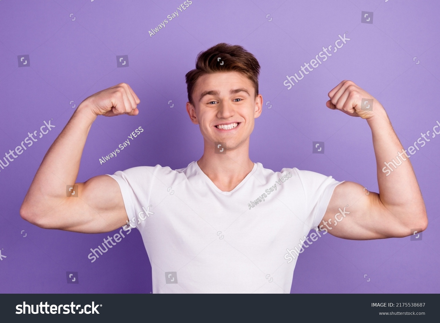 Young caucasian happy sporty fitness man 20s show biceps muscles hand isolated on bright color background studio portrait #2175538687