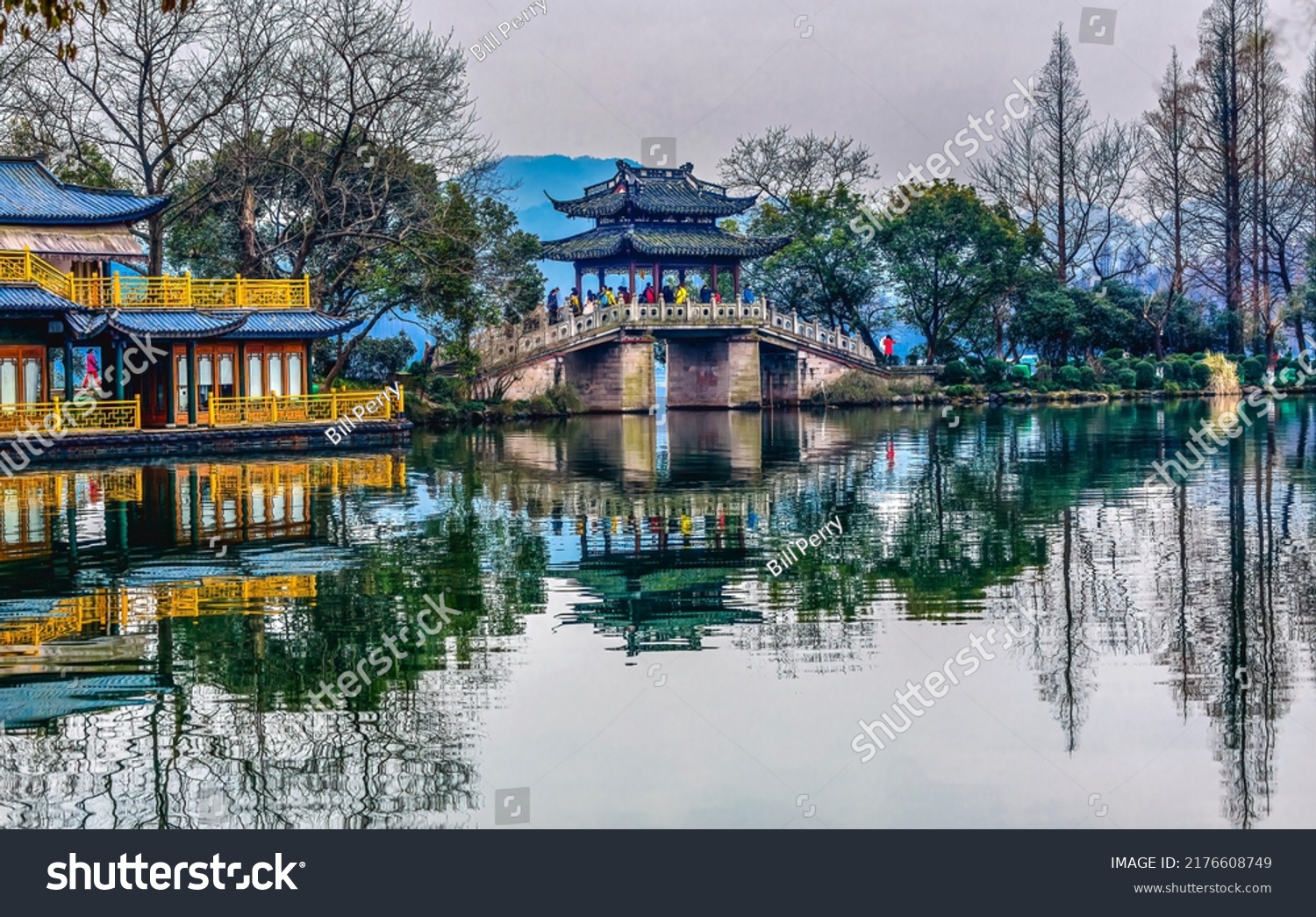 Old Chinese Bridge Quyuan Garden Yellow Boat West Lake Hangzhou Reflection Zhejiang Province China .  #2176608749