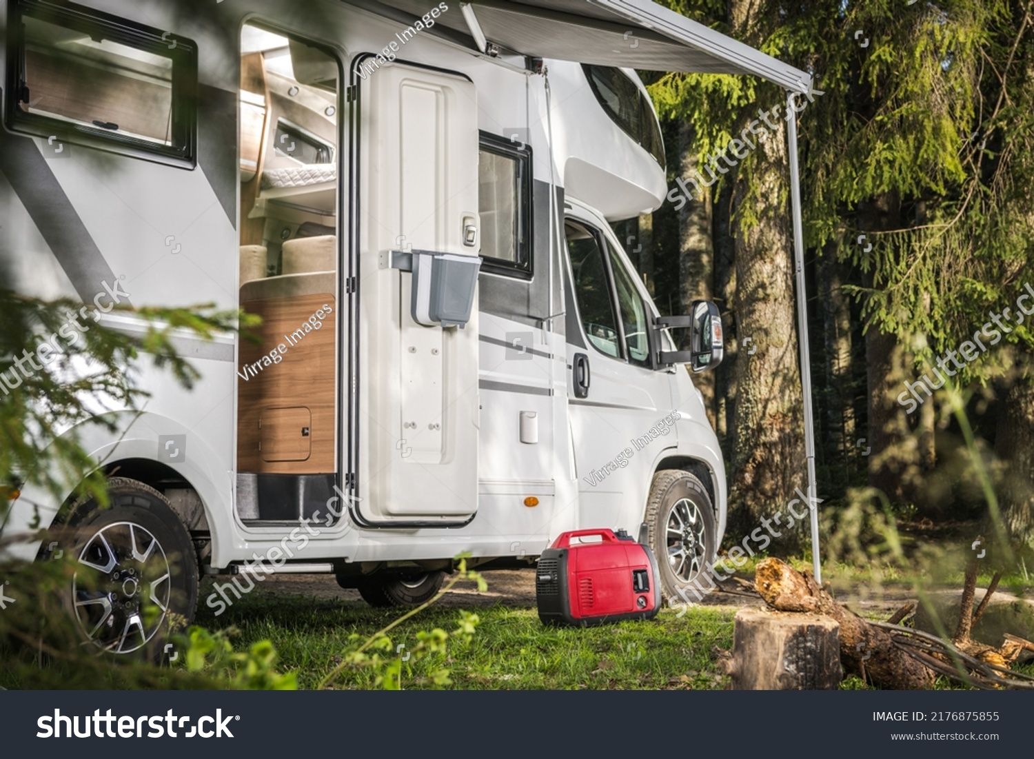 Recreational Vehicles Theme. Class C Camper Van RV and a Gas Generator Staying Next to the Motorhome. Summer Vacation. #2176875855