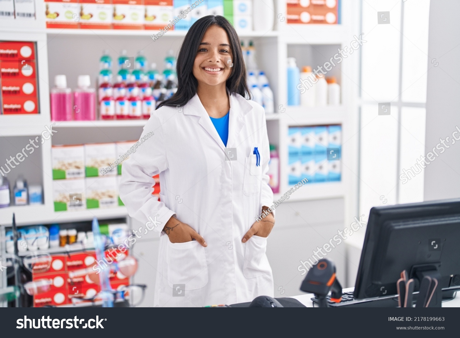 Young hispanic woman pharmacist smiling confident standing at pharmacy #2178199663
