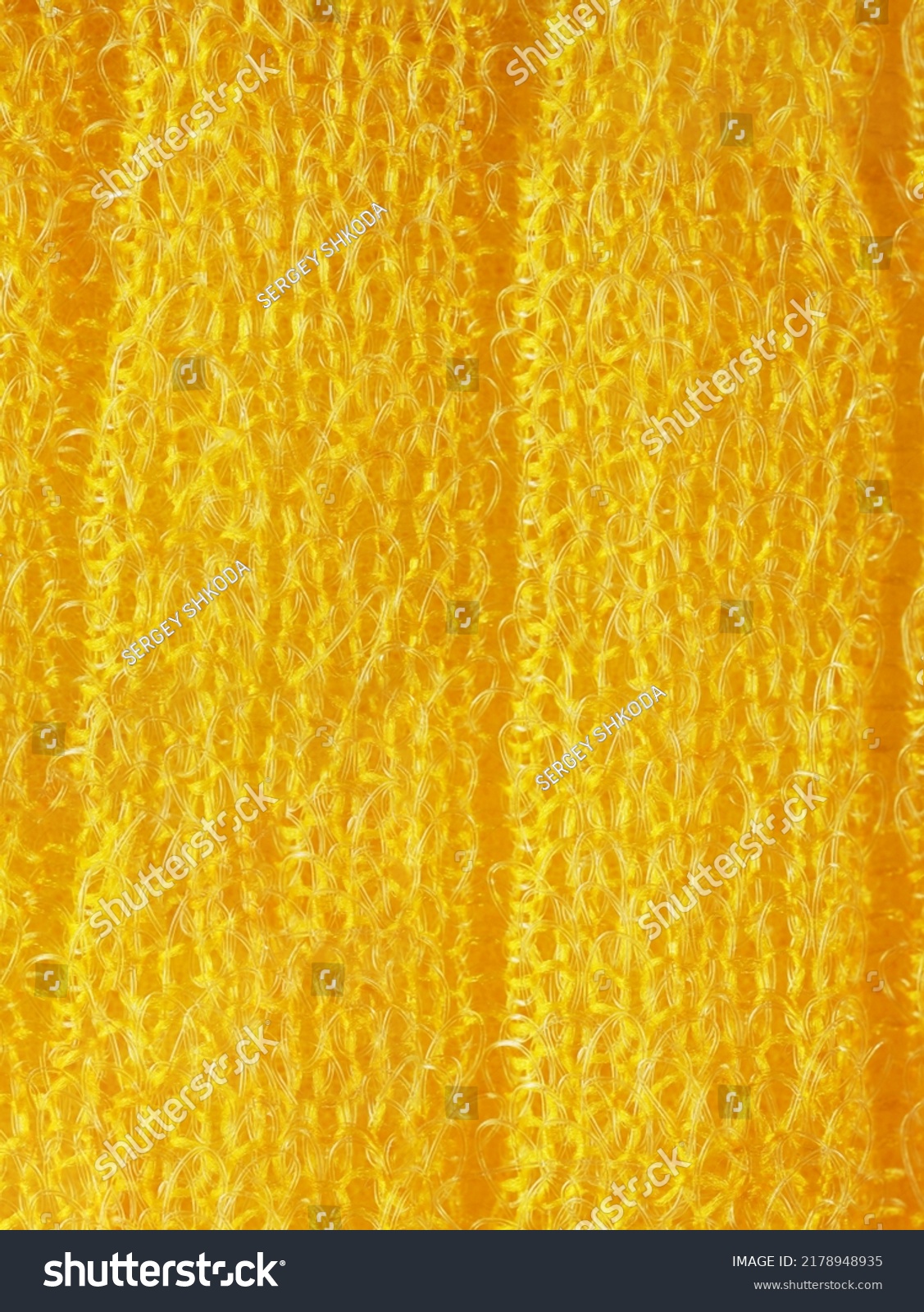 closeup, background, texture, large long vertical banner. heterogeneous surface structure bright saturated yellow sponge for washing dishes, kitchen, bath. full depth of field. high resolution photo #2178948935