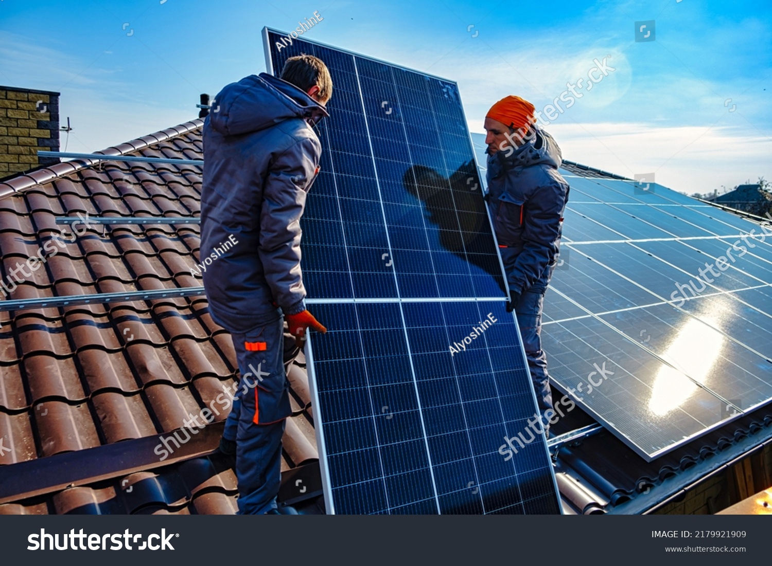 Solar panels on roof.  Installing a Solar Cell on a Roof. Workers installing solar cell farm power plant eco technology. #2179921909