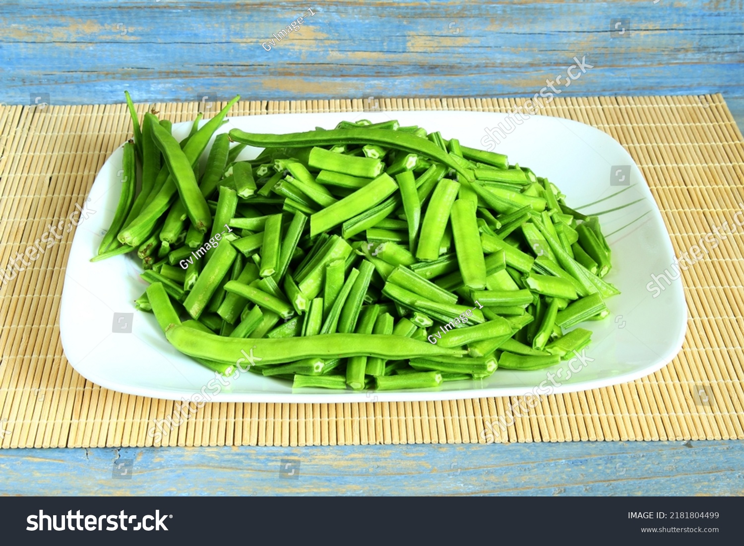 fresh chopped or cut indian vegetable green cluster beans or guar beans in dish ready for cooking #2181804499