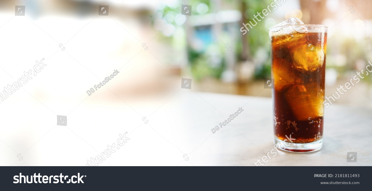 Close up shoot with copyspace of cola soda with ice in a drinking glass. Sparkling cola filled in the glass with ice. #2181811493