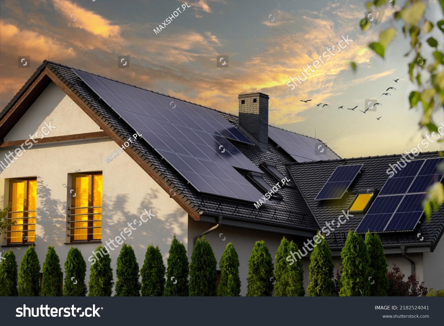 Modern house with solar panels. Night view of a beautiful white house with solar panels. #2182524041