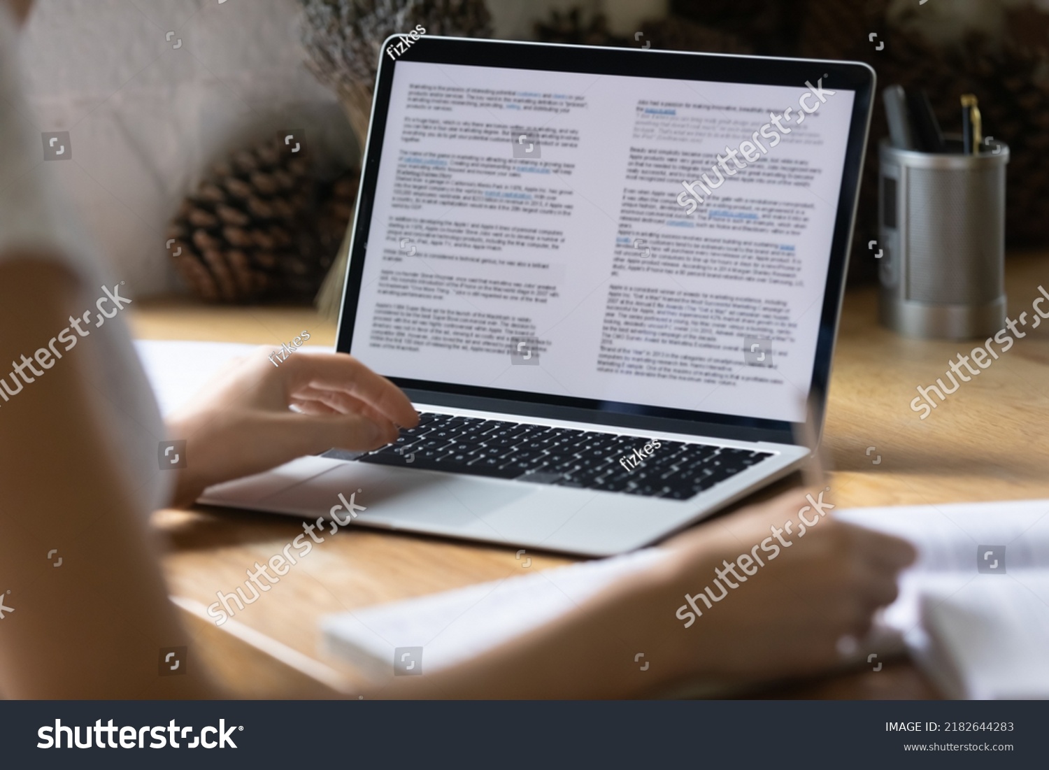 Close up view of modern technology digital gadget opened computer with electronic documents on screen. Young woman preparing report or reading scientific article, studying at home, education concept. #2182644283