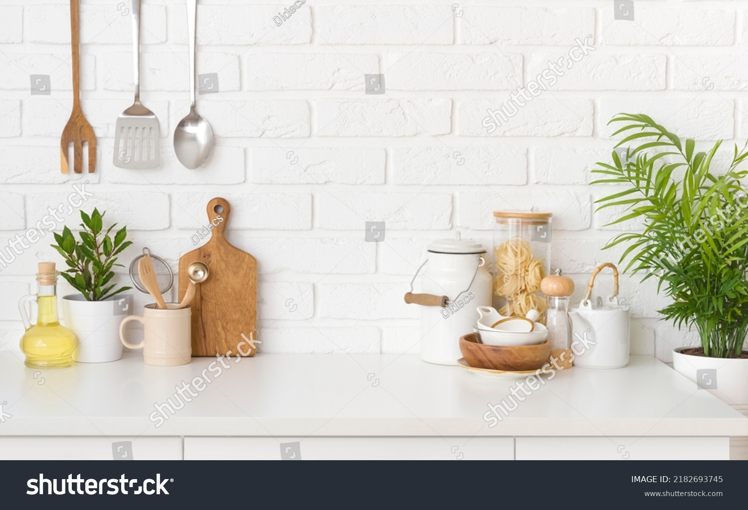Kitchen utensils, cooking ingredients and kitchenware on white counter table #2182693745