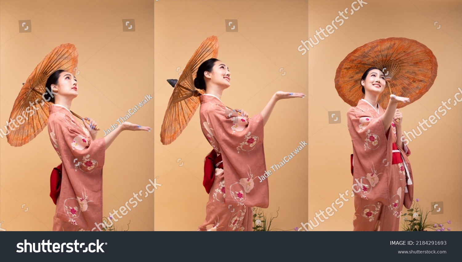 Young 20s Asian Japanese woman wear traditional Kimono, hold painting umbrella and hand for rain. Japan Kimono female express felling happy smile over pastel yellow background isolated copy space #2184291693