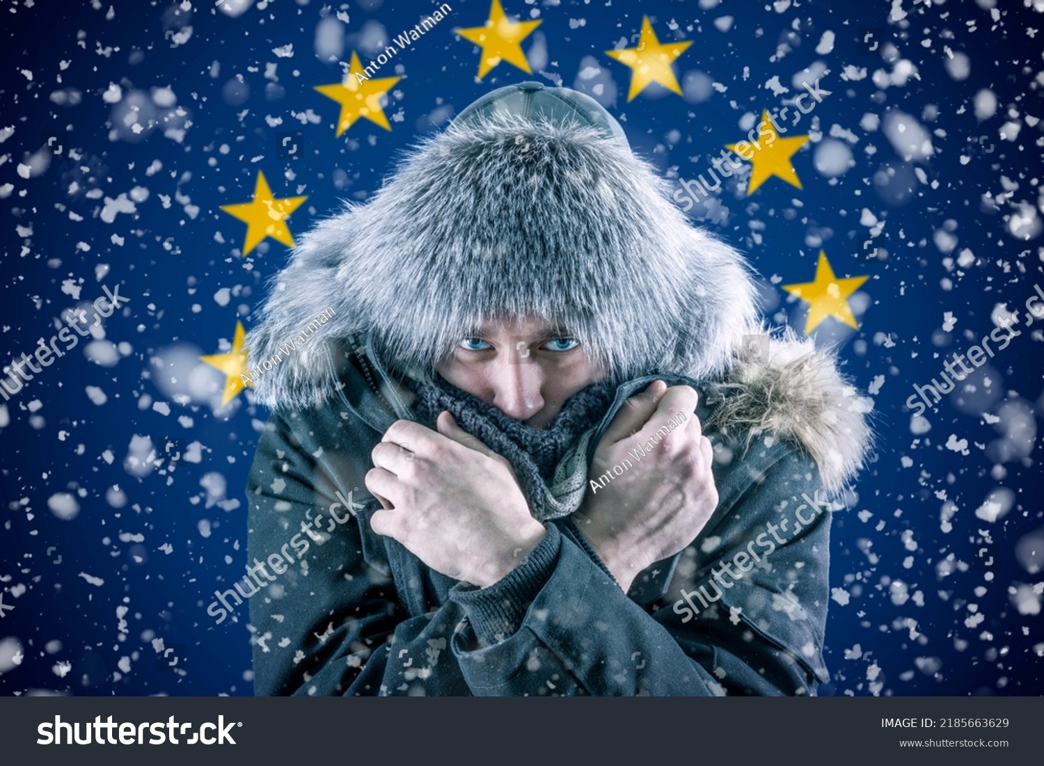 Transition to renewable energy sources. Energy crisis in Europe. A citizen of Europe freezes in front of the flag. Increase in the price of natural gas for home heating. #2185663629