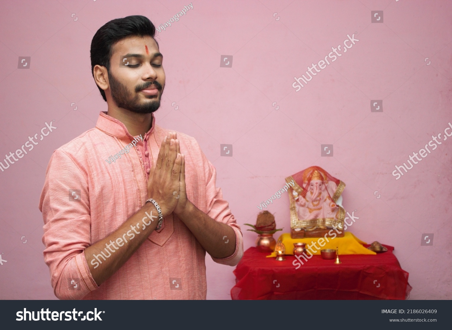 Young Indian Teenager Boy  Celebrating Ganesh Chaturthi Festival (Ganesh Chaturthi Concept) #2186026409