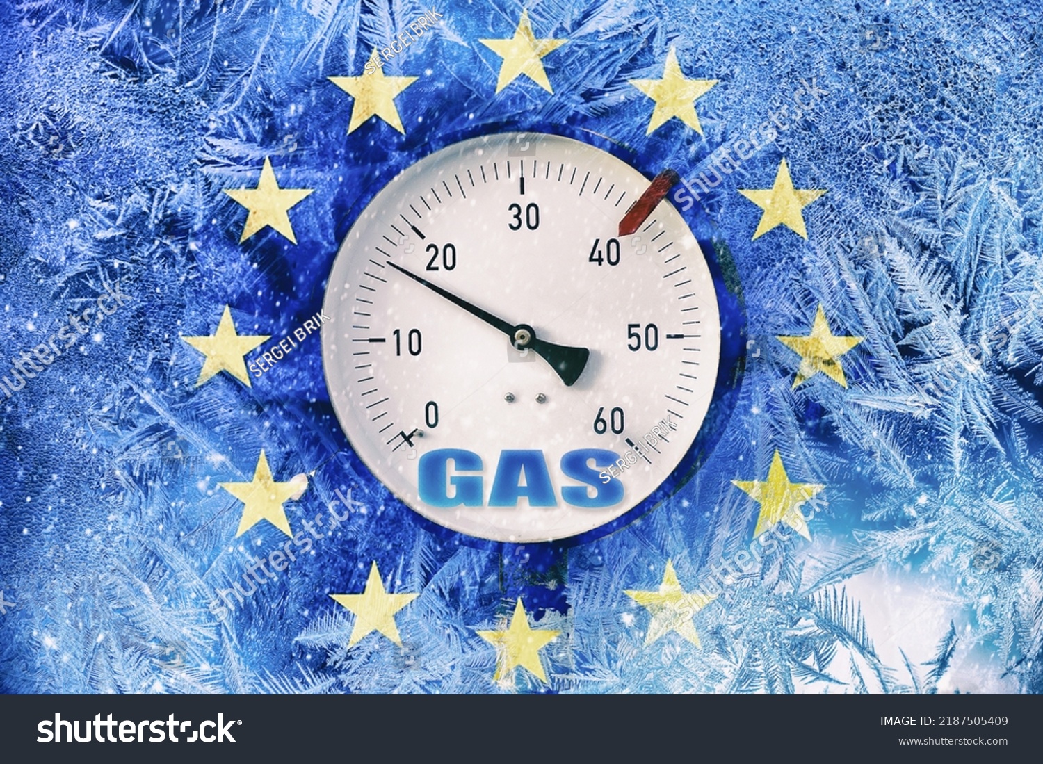 gas pressure gauge on background of frozen flag of European Union, energy crisis in European countries in the winter season, transition to renewable energy sources, the increase in natural gas prices #2187505409