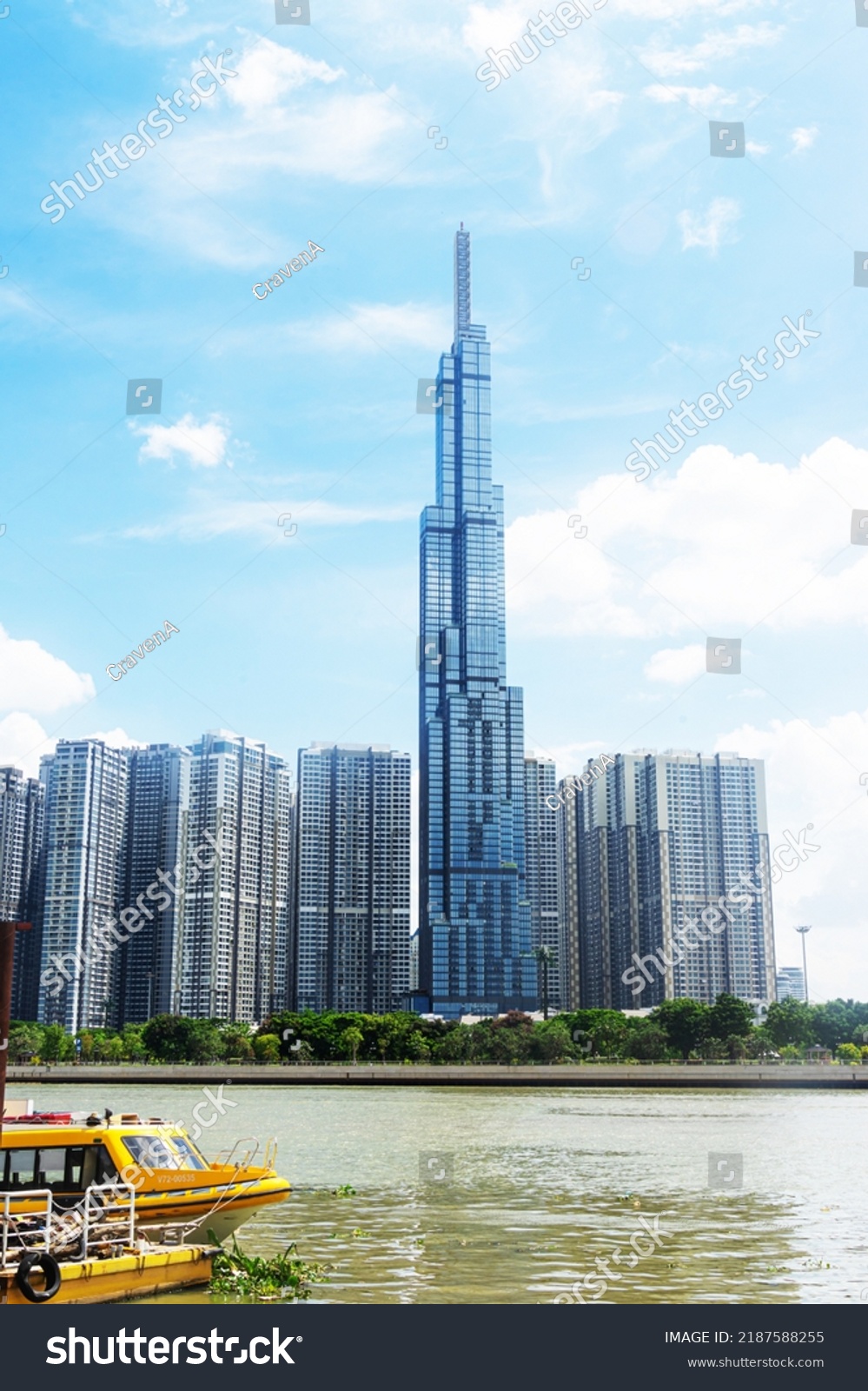 view of blue sky at Landmark 81 is a super tall skyscraper in center Ho Chi Minh City, Vietnam and Saigon bridge with development buildings, energy power infrastructure. Travel concept. #2187588255