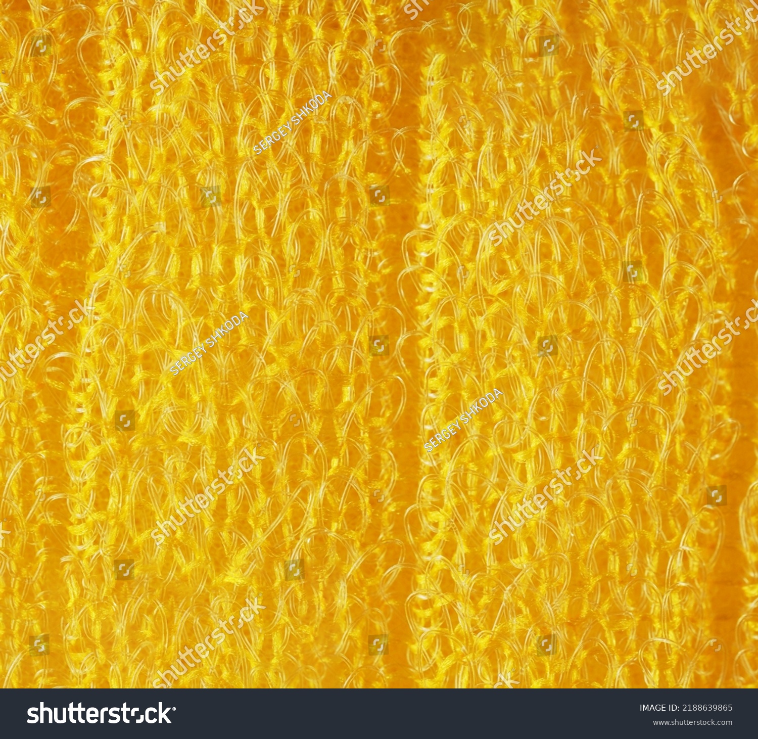 closeup, background, texture, large long vertical banner. heterogeneous surface structure bright saturated yellow sponge for washing dishes, kitchen, bath. full depth of field. high resolution photo #2188639865