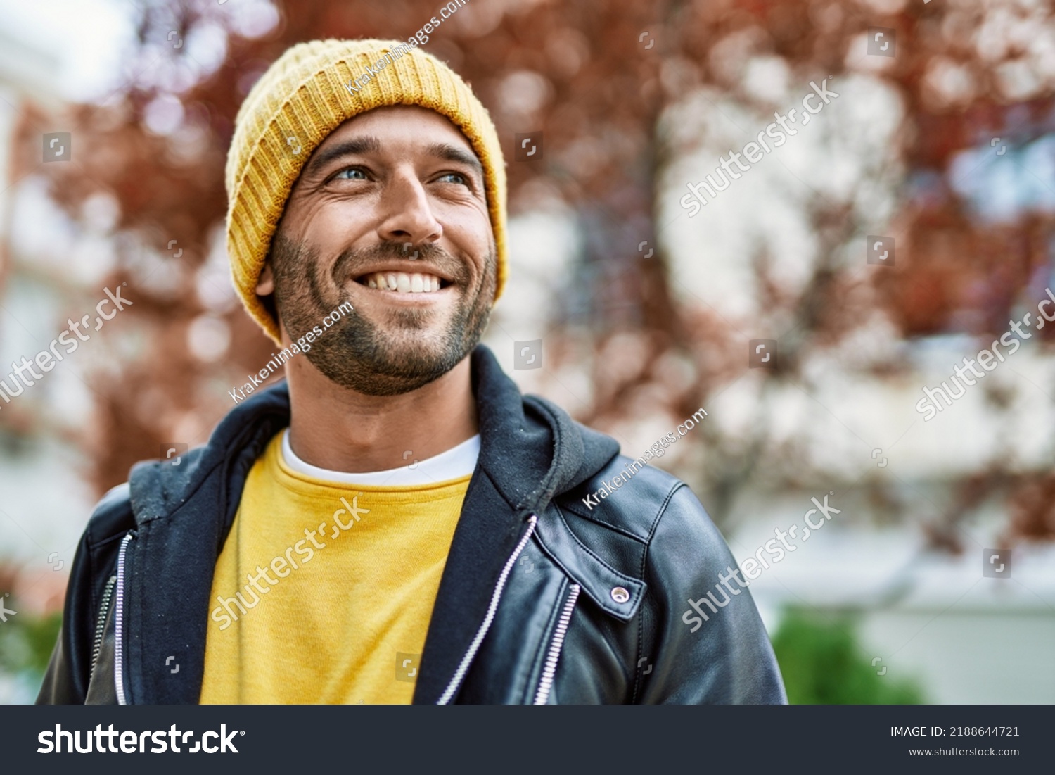 Handsome hispanic man with beard smiling happy outdoors #2188644721