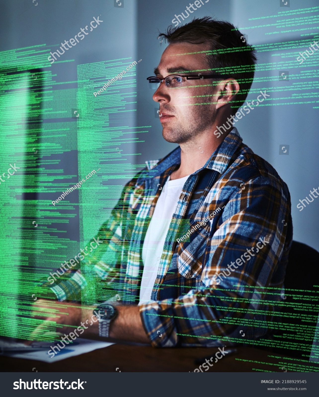 Thinking computer engineer reading cgi code, typing or searching on computer while designing or developing website late at night. Serious web developer planning, coding or innovating website ux or #2188929545