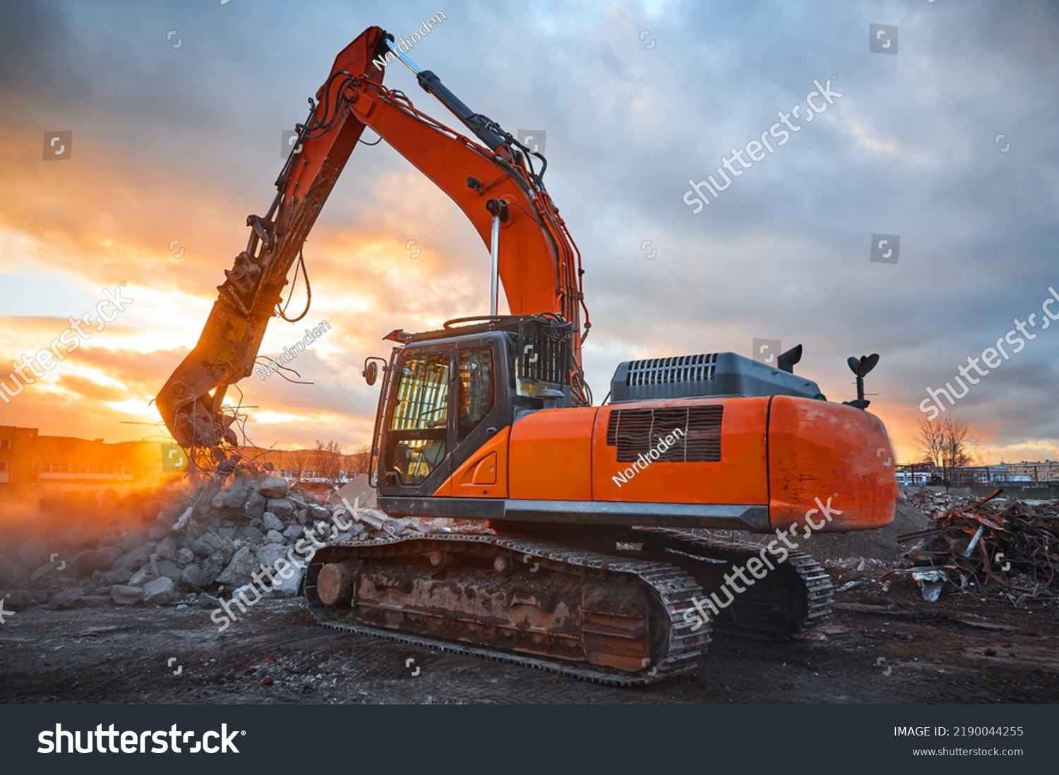 Excavator with concrete crusher on rig at demolition site #2190044255