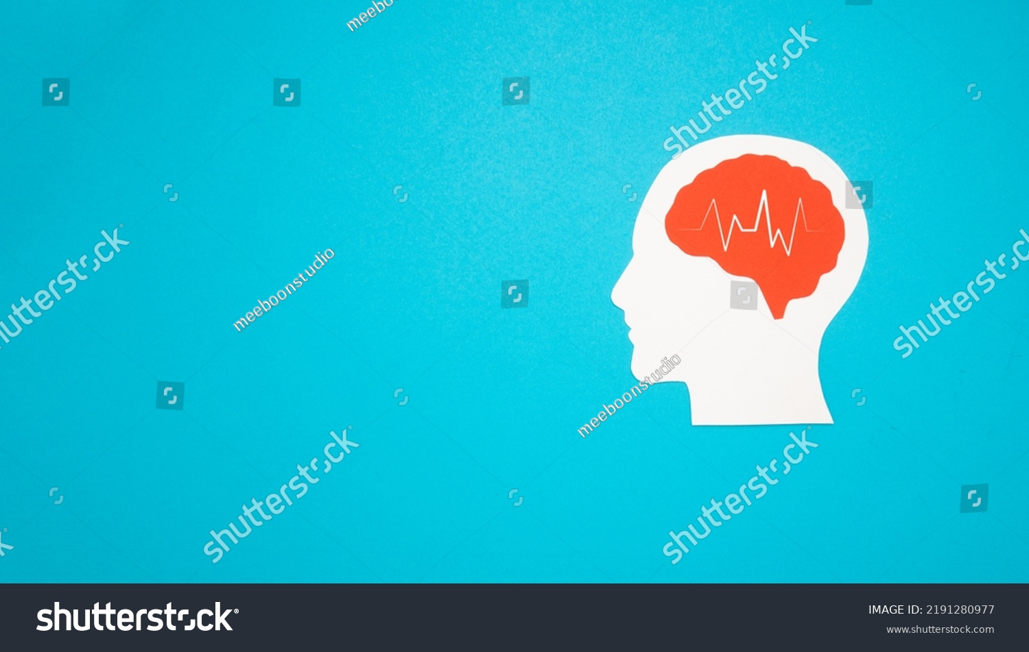 A brain shape made from paper on a light blue background. Awareness of Alzheimer's, Parkinson's, dementia, stroke, seizure, or mental health. Neurology and Psychology care #2191280977
