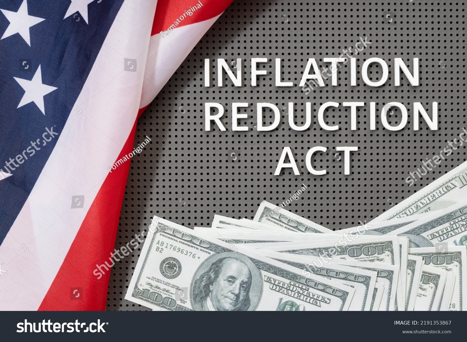 Inflation reduction Act law concept. Fat lay of text, american flag and dollar banknotes #2191353867