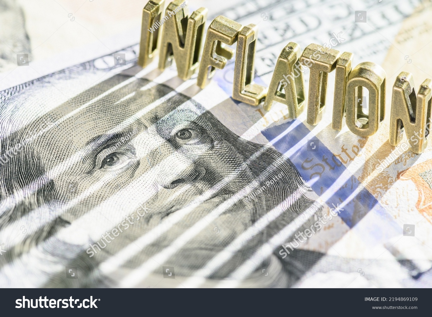 Inflation and consumer spending, financial concept : Word INFLATION on a US dollar note with a long shadow, depicting inflation that raise prices, lowering purchasing power, lowers currency valuation. #2194869109