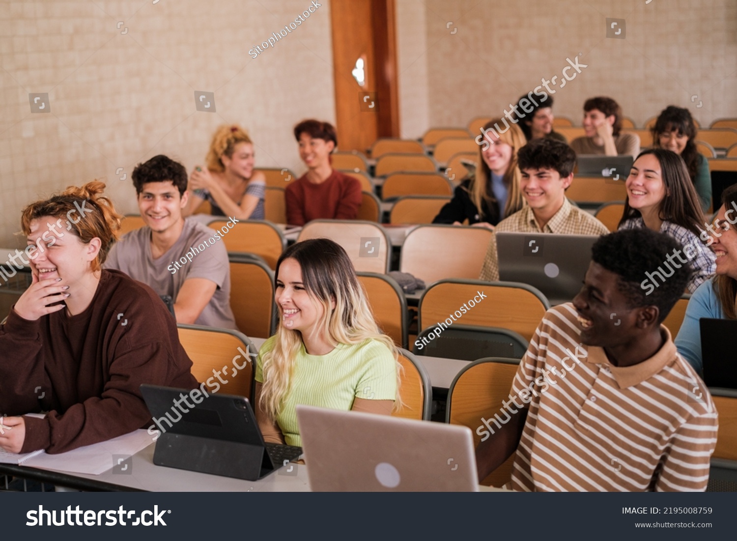 Heterogeneous group of students paying attention to university classes #2195008759