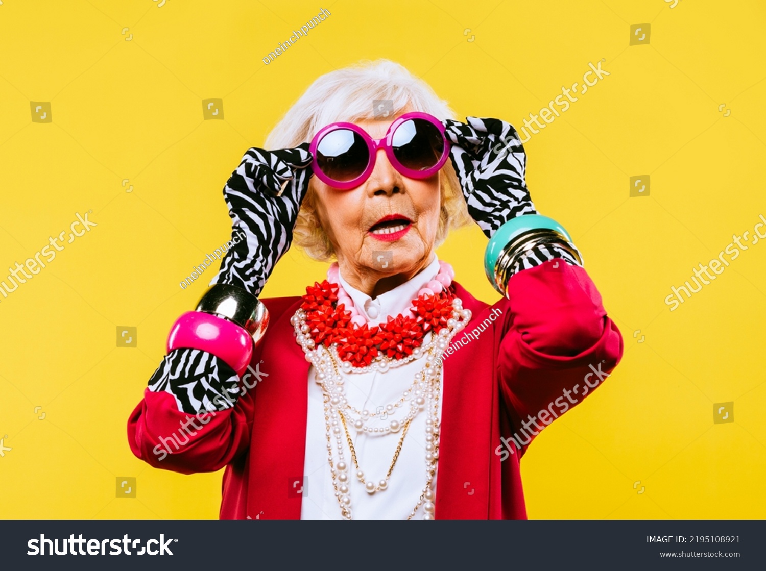 Happy and funny cool old lady with fashionable clothes portrait on colored background - Youthful grandmother with extravagant style, concepts about lifestyle, seniority and elderly people #2195108921