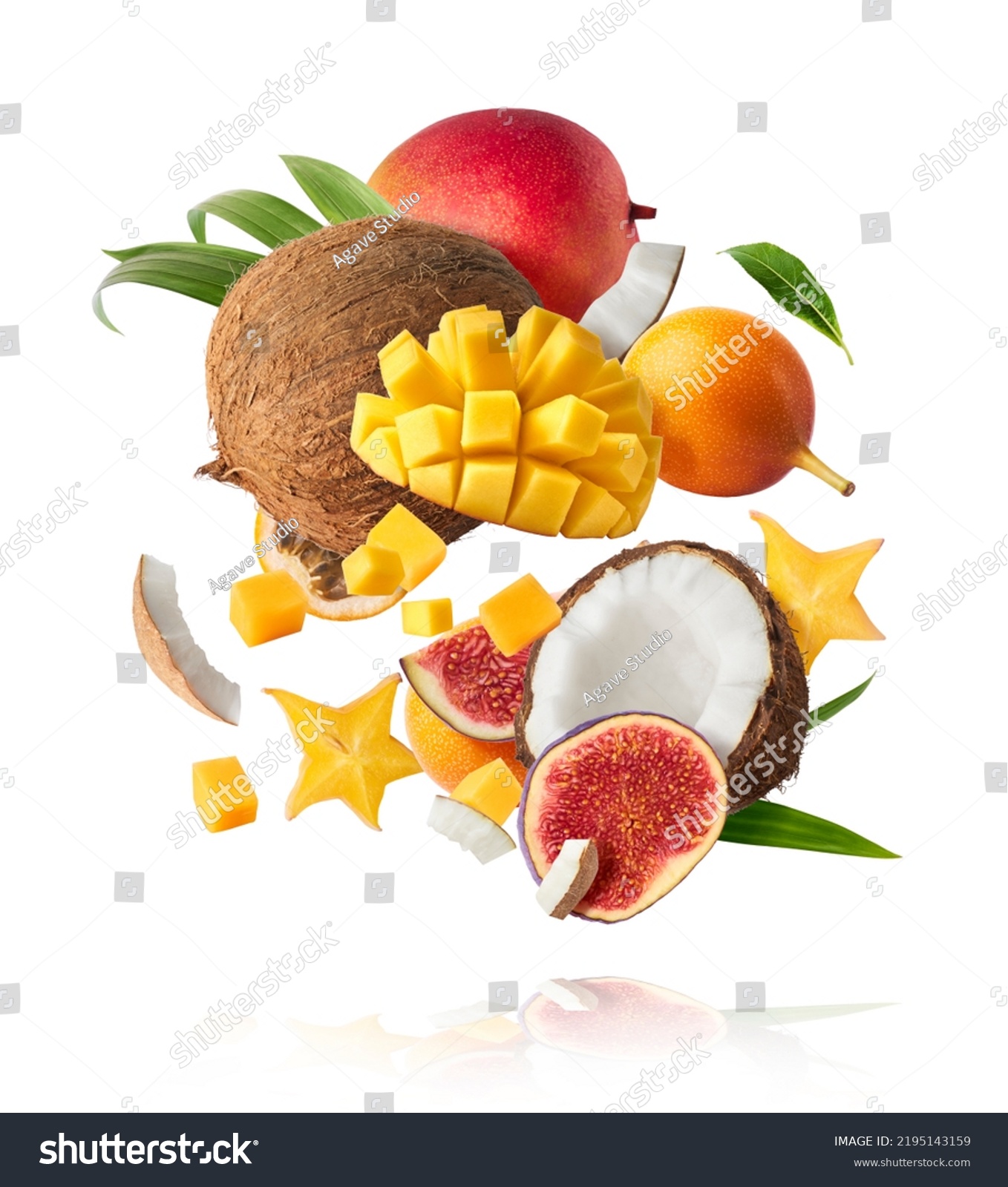 Exotic fruit mix, coconuts, mango, fig, passiflora, carambola falling in te air isolated on white background. Food levitation, zero gravity conception. High resolution image #2195143159