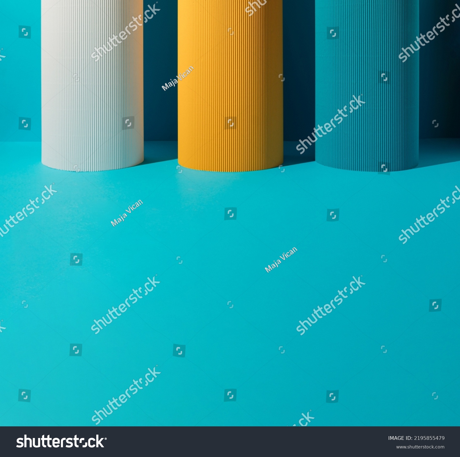 Three paper pillars - white, yellow and blue on blue background with copy space. #2195855479