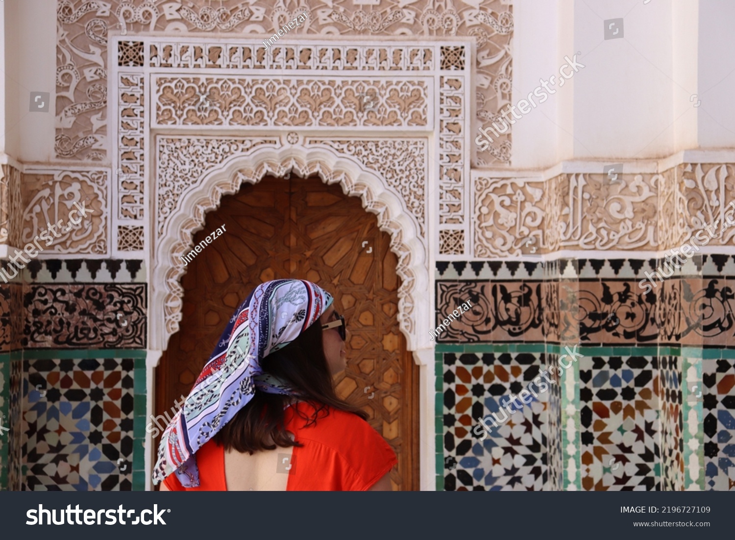Tourist woman with scarf in a monument of Marrakech (Morocco) #2196727109