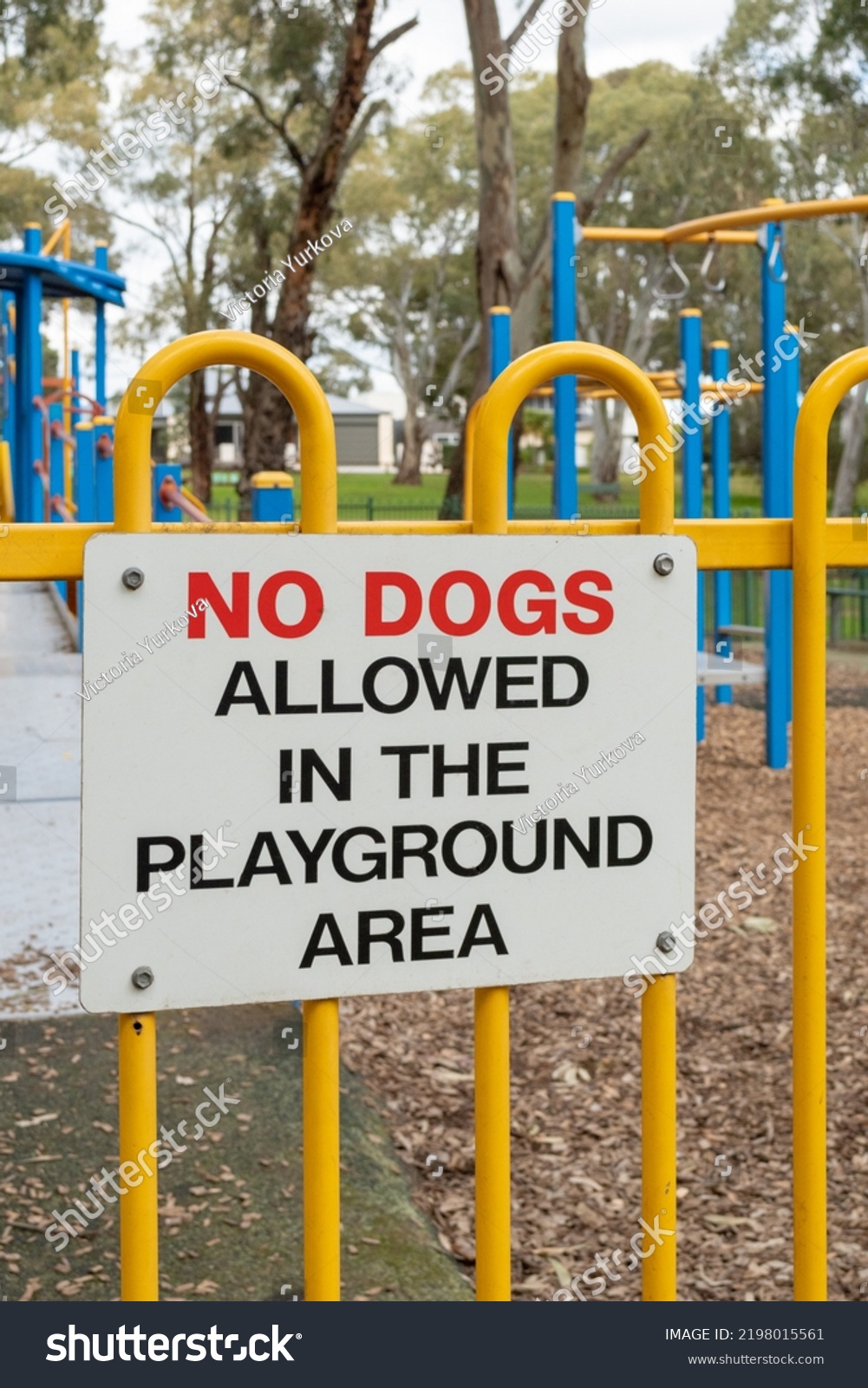 No dogs allowed in the playground area sign in the park #2198015561