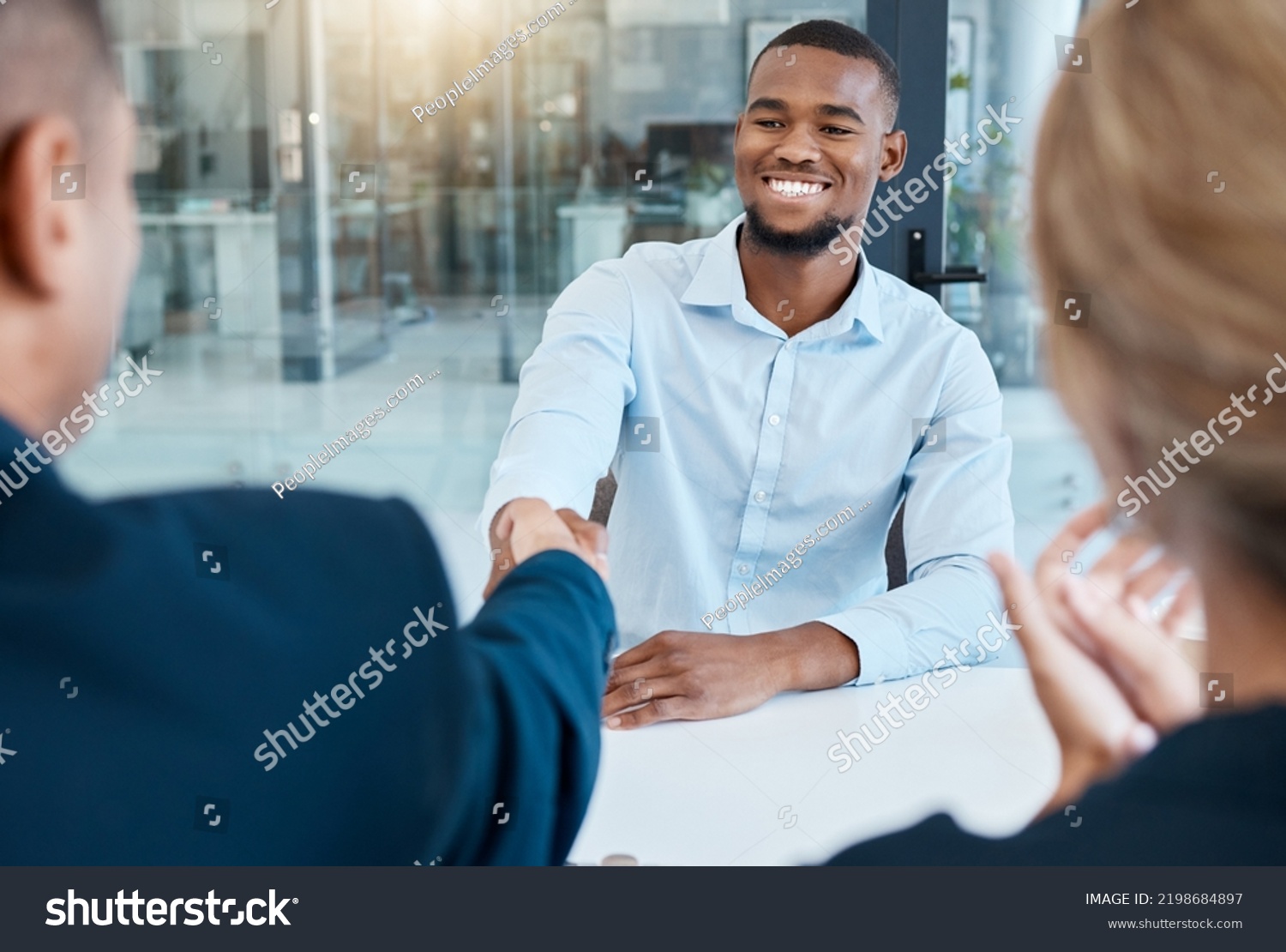 Shaking hands, interview and business people give a handshake after hiring a new company employee. Onboarding, thank you and management welcome young African worker a job promotion in office meeting #2198684897