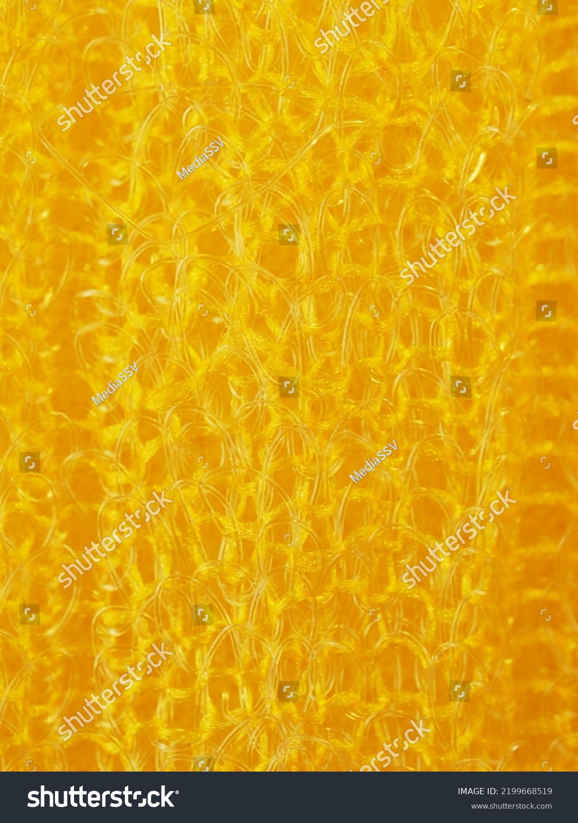 close up, background, texture, large vertical banner. heterogeneous surface structure bright saturated yellow sponge for washing dishes, kitchen, bath. full depth of field. high resolution photo #2199668519