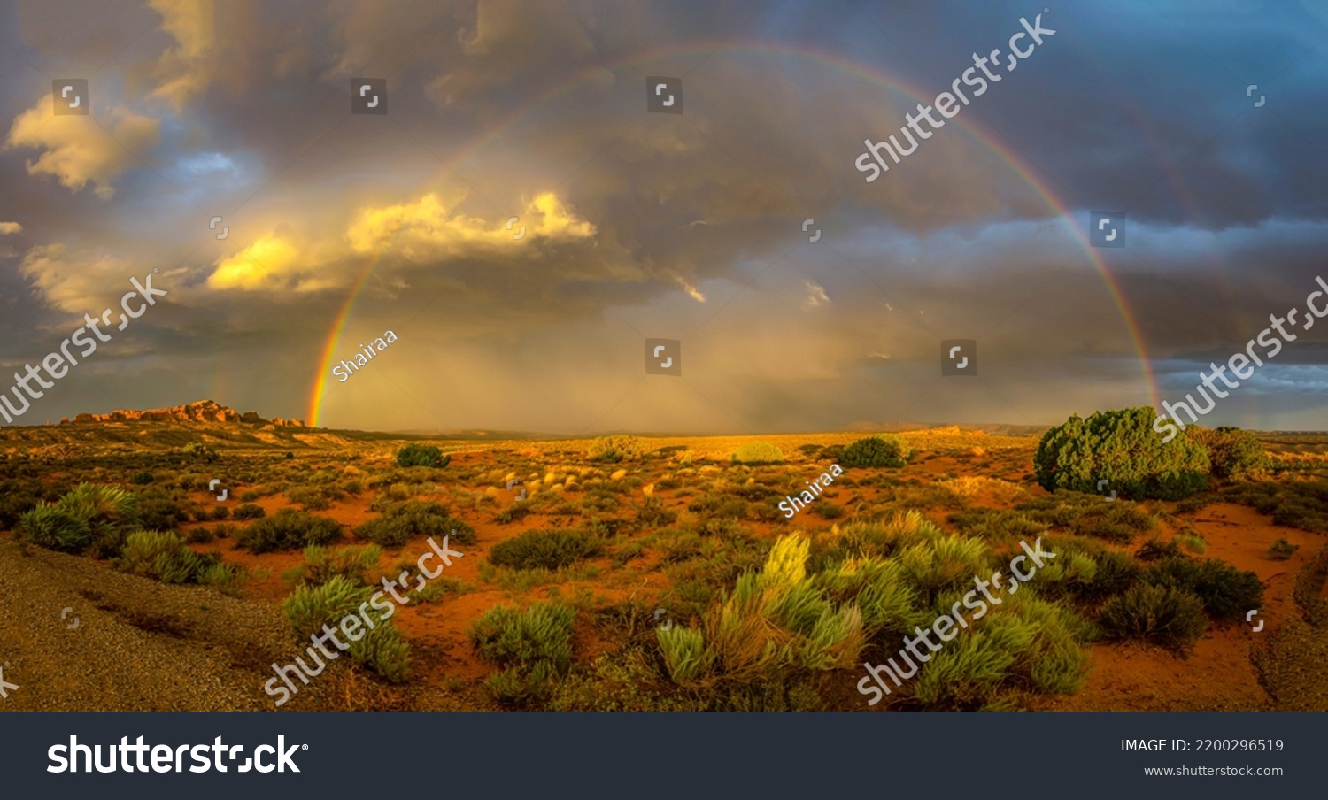 Rainbow panorama over the canyon desert. Canyon desert rainbow. Rainbow in canyon desert. Beautiful rainbow in canyon desert #2200296519