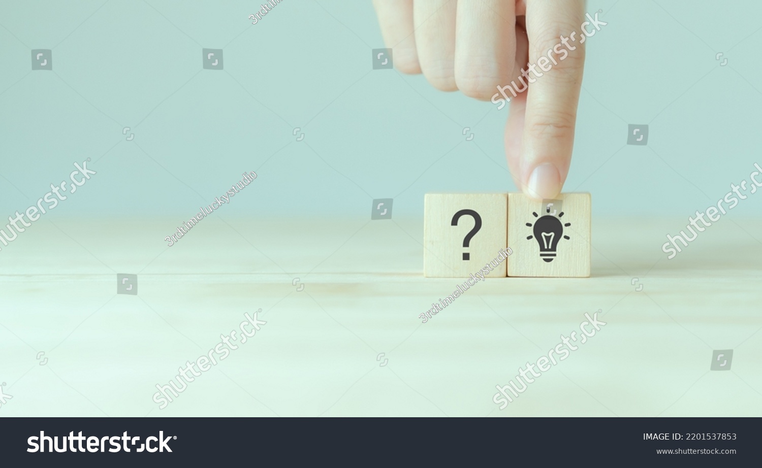 Question marks and light bulb symbolizing idea or solution. Problem solving skill, creativity, innovation, brainstorming, critical thinking and root cause analysis concept. Question, idea and answer. #2201537853