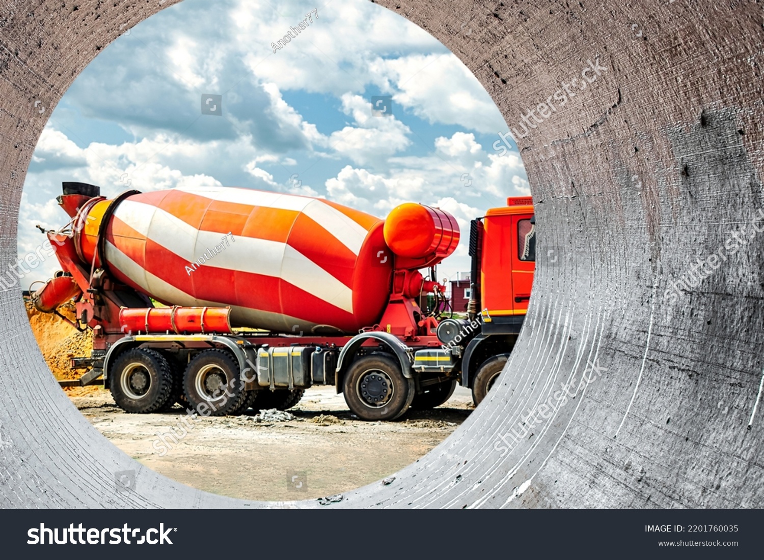Concrete mixer truck in front of a concrete batching plant, cement factory. Loading concrete mixer truck. Close-up. Delivery of concrete to the construction site. #2201760035