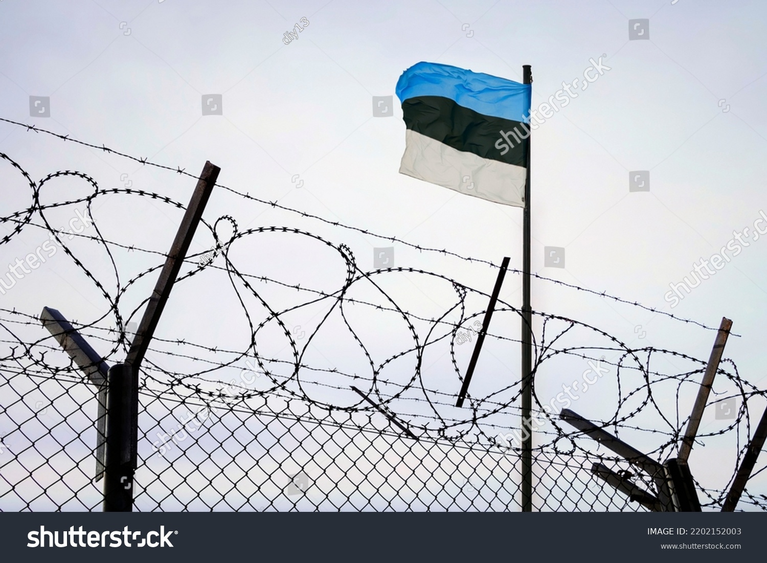 Concept of estonia closed borders with flag and wire fence. Ukraine immigration and homeland security. estonian Russian border #2202152003