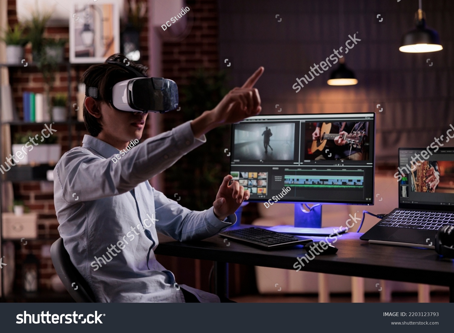 Film maker editing movie montage with virtual reality glasses, using multimedia production software to create footage. Edit video with color grading and visual effects, working with vr goggles. #2203123793