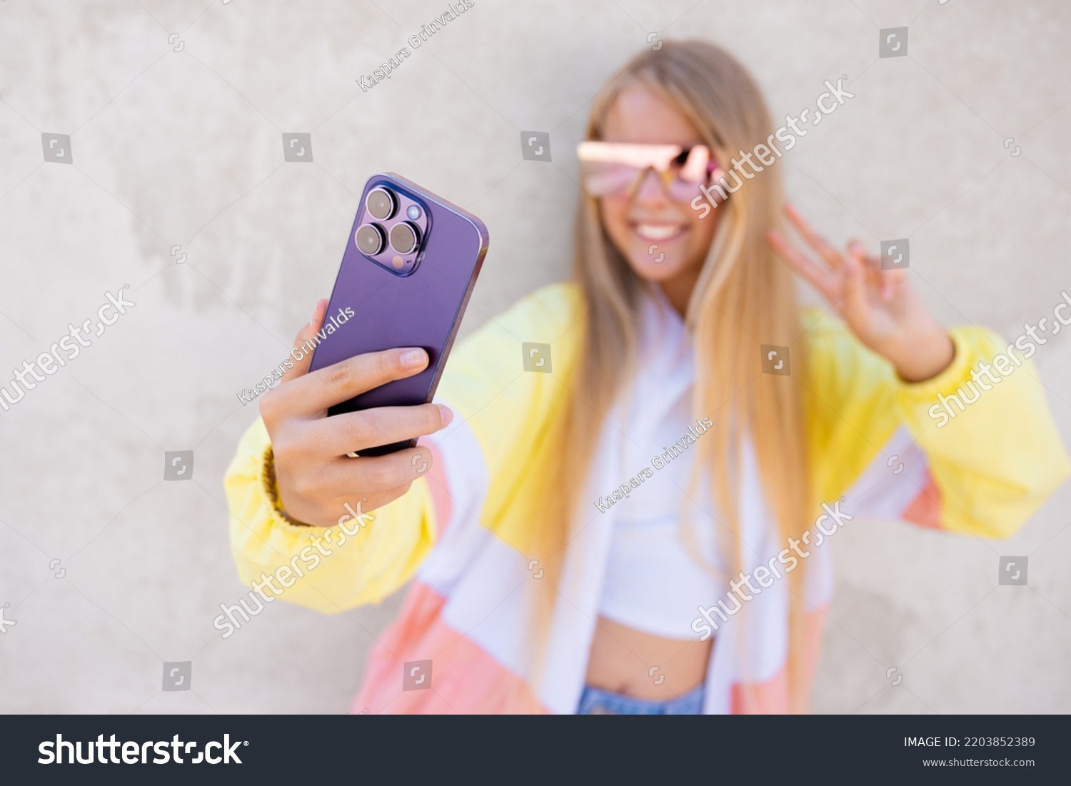 Girl taking selfie with mobile phone #2203852389