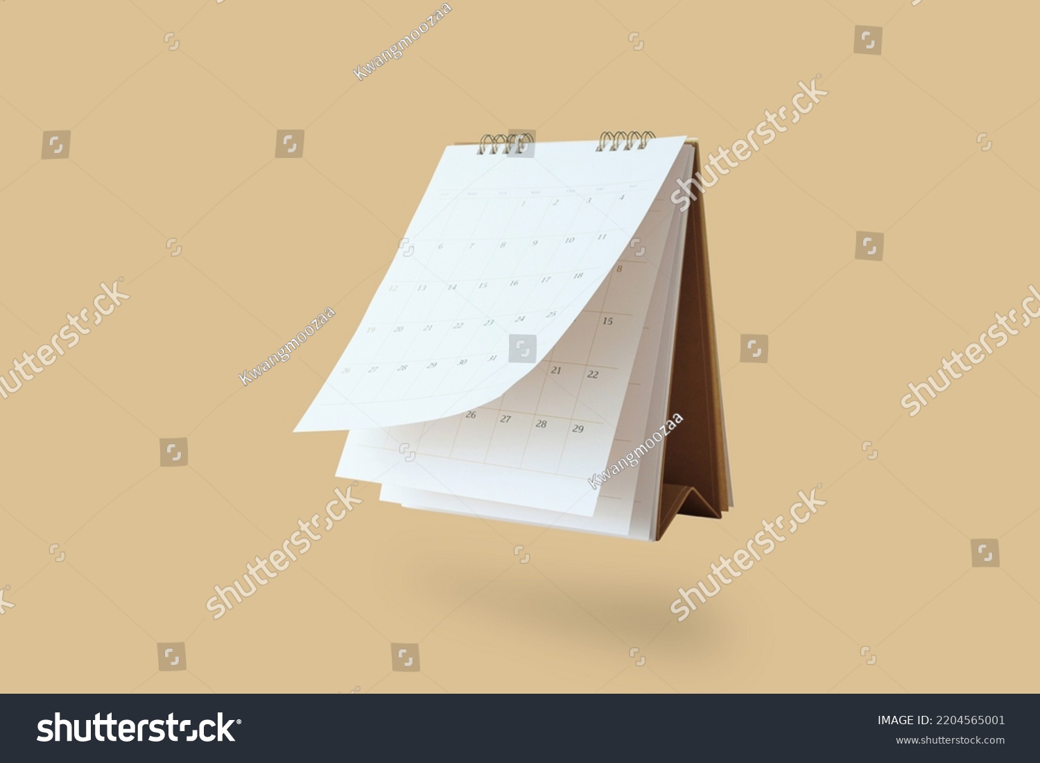 White paper desk calendar flipping page mockup isolated on brown background #2204565001